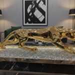 Majestic Golden Bengal Tiger: Prowling Figurine with Signature Black Stripes.